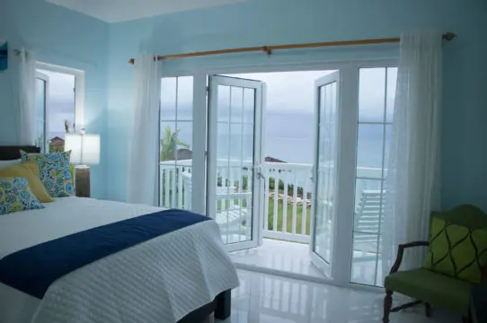 Main bedroom opening onto the sea-facing balcony